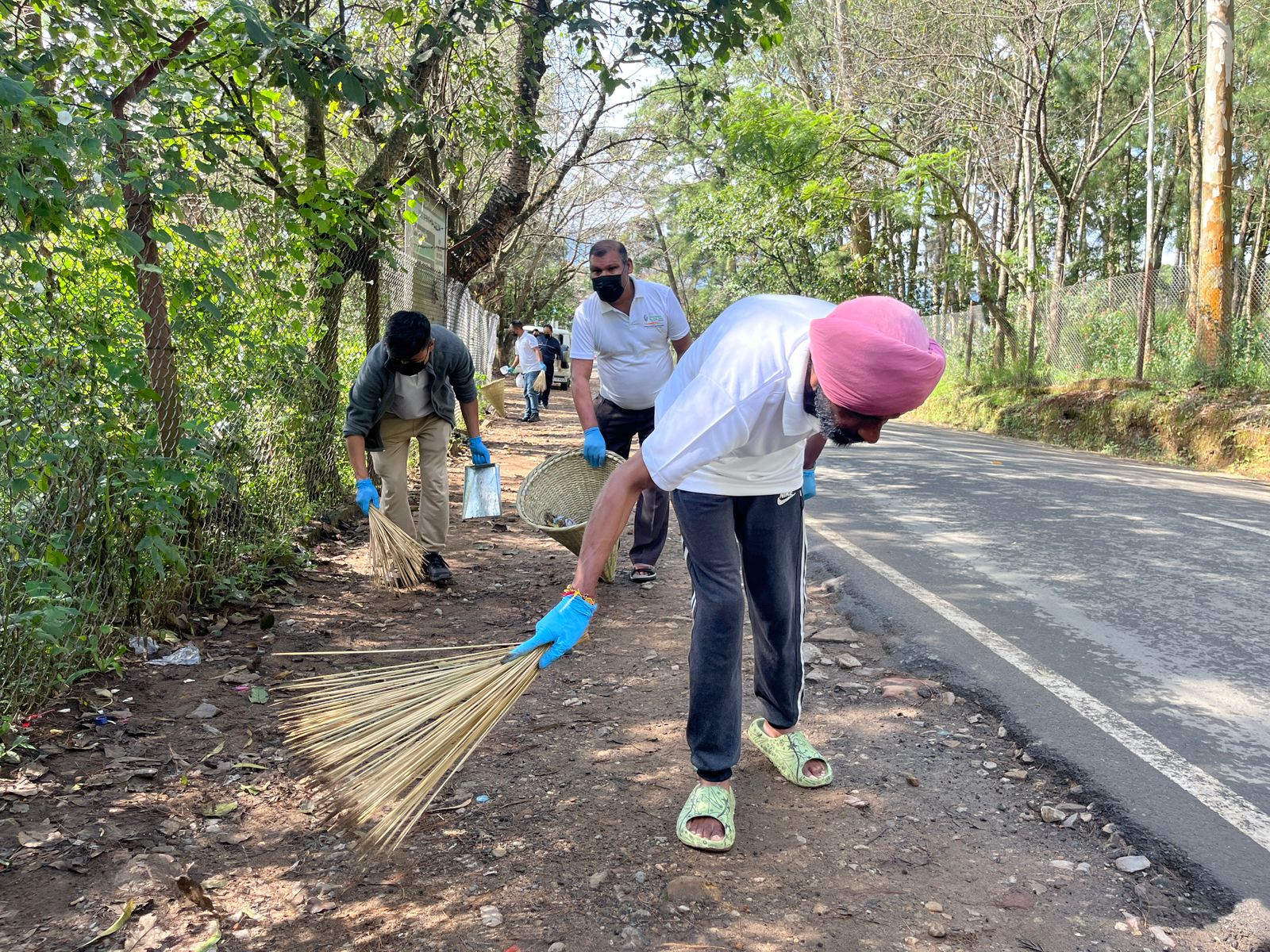 NEC staff engaged in cleanliness efforts during the Transfor