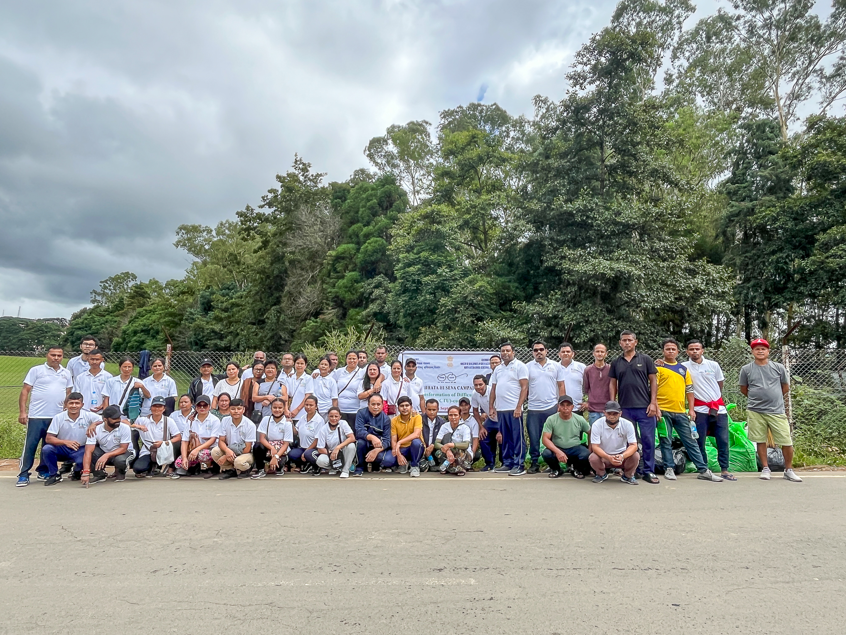 NEC officials posing for a group photograph after the Transf