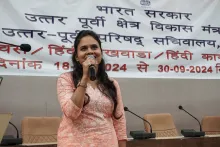 NEC employee participating in the Hindi music competition or