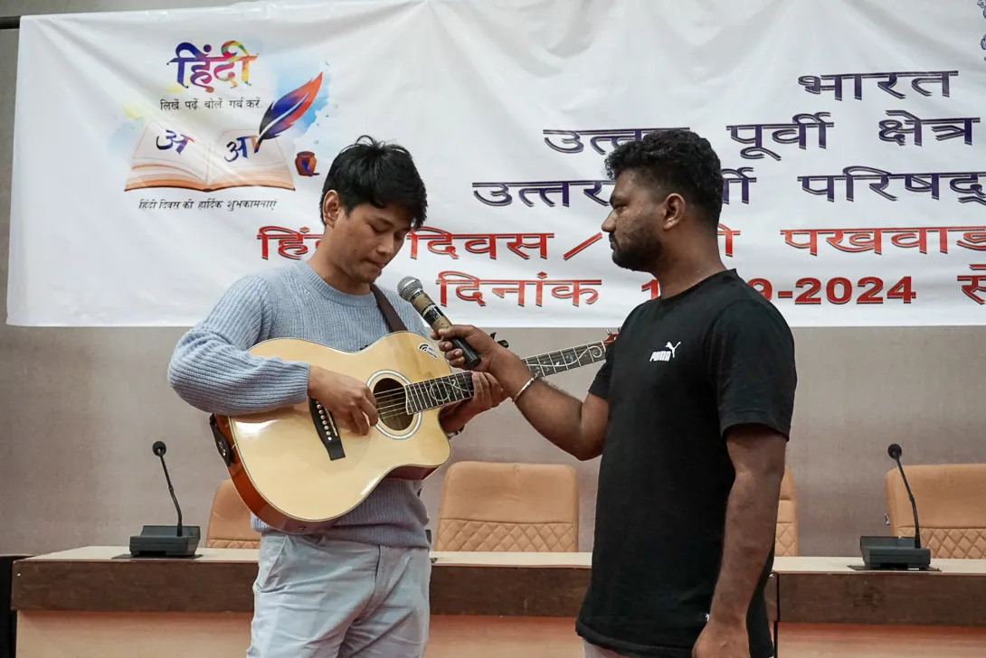 NEC employee participating in the Hindi music competition or