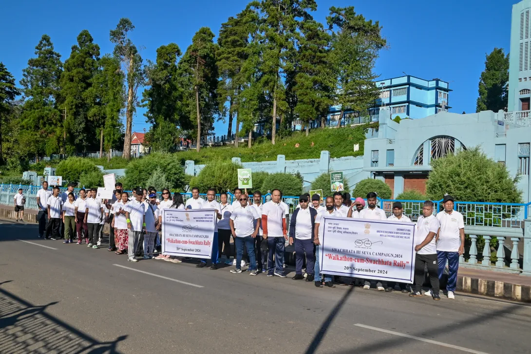 NEC staff posing for a group photograph during the Walkathon